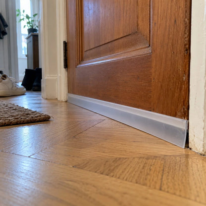 Seal strip fitted under a wooden door
